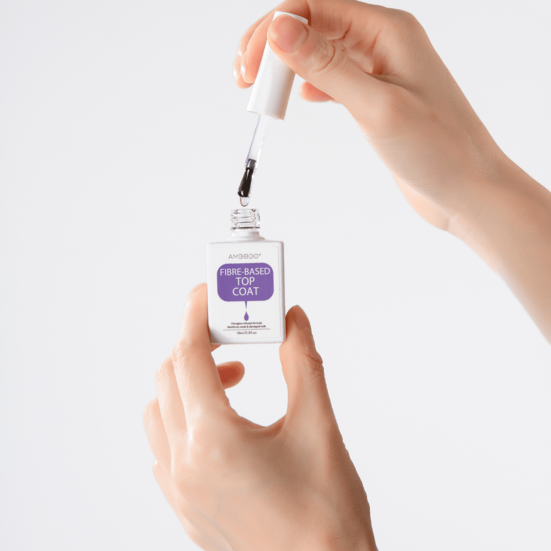 A bottle of Ambedo fibre glass topcoat, a clear high-shine sealant that locks in color and prevents chipping.